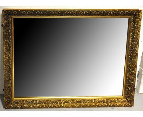 A large rectangular gilt framed floral decorated mirror, length 108cm.