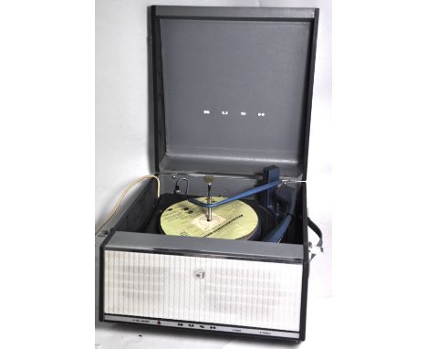 A retro 1960s portable Bush record player. CONDITION REPORT Some age related wear. Untested.