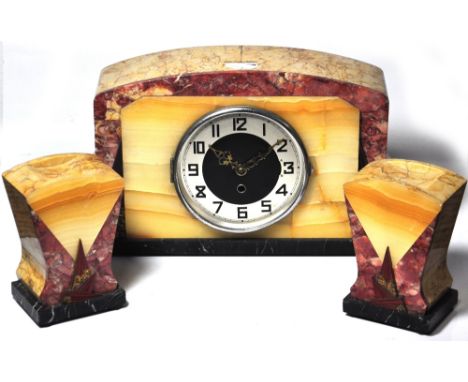 An Art Deco style marble mantle clock, the circular dial set with Arabic numerals, with replaced simple battery movement, com