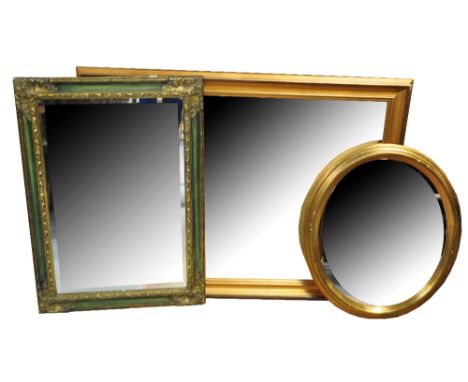 A large rectangular gilt framed mirror, a smaller example and an oval mirror (3).