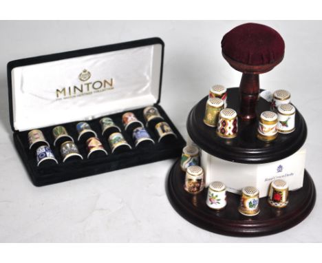 A cased set of Minton thimbles and a collection of Royal Crown Derby thimbles. CONDITION REPORT No visible signs of damage.