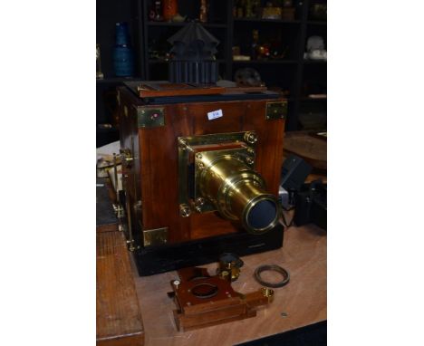 A Newton &amp; Co, Fleet St, London mahogany and brass magic lantern/ projector with two boxes of slides
61cm (including cowe