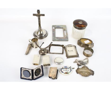 An INRI crucifix on a loaded base marked 'Sterling Silver' and other items. Including; a miniature mug with a scroll handle, 