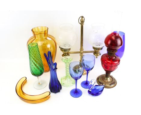 A group of assorted glassware. Including various colours, an red oil lamp and brass lamp, etc. Max. H43cm