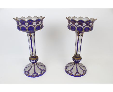 A pair of late 19th century clear, white and blue glass lustres. With gilt floral details and rims, H33cm (missing drops) Con