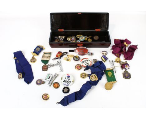 Enamel badges and transport related medals, in a lacquer box
