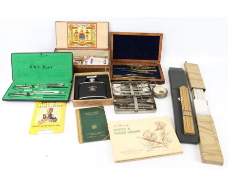 An assortment of vintage collectables. Including boxed measuring tools, a vintage cigar box, tea cards, extendable rulers, et