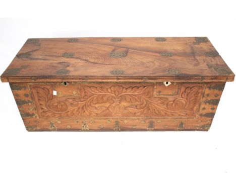 A carved hardwood blanket box trunk. With metalwork decoration and swing handles. L111cm x D46cm x H40cm