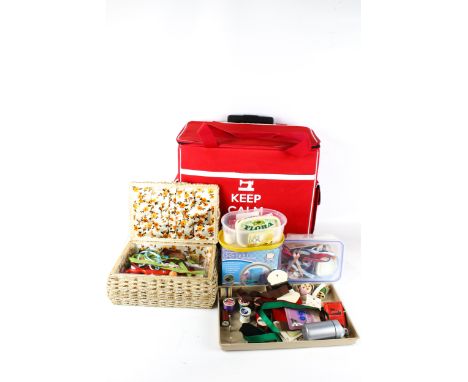 A sewing box trolley with a retractable handle and contents. Including scissors, tools, assorted threads, etc. H42cm