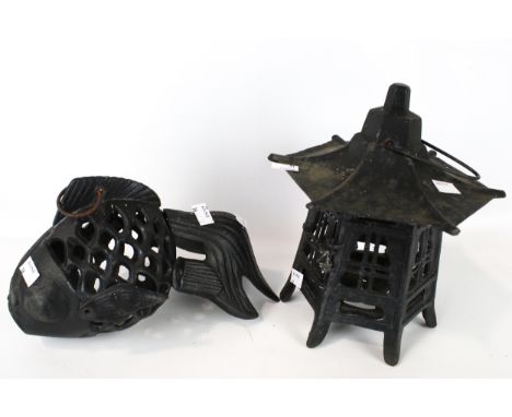 A cast metal model of a fish and a lantern. Both suspended from hooks, the lantern, H25cm, the fish H20cm