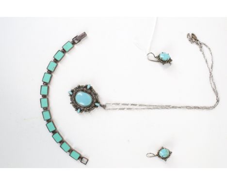 A small collection of imitation-turquoise and marcasite jewellery. Comprising; a shaped-oval pendant centred with an oval cab
