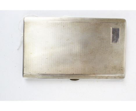 A silver rectangular engine-turned cigarette case. With a vacant rectangular reserve, mark of Walker & Hall, Chester 1938, ap