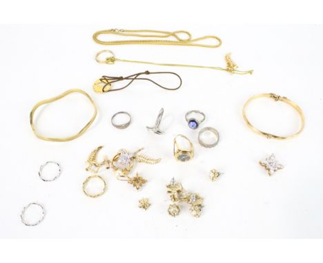 A collection of miscellaneous vintage and modern costume jewellery. Including a 'metal core' faceted bangle; a wavy bangle; v