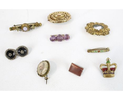 Ten antique brooches. Including opal, onyx, amethyst and memory brooches