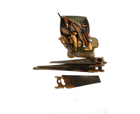 An assortment of vintage hand tools and a set of scales.  Including hack saws, jack saws, files, tape measures and a set of g