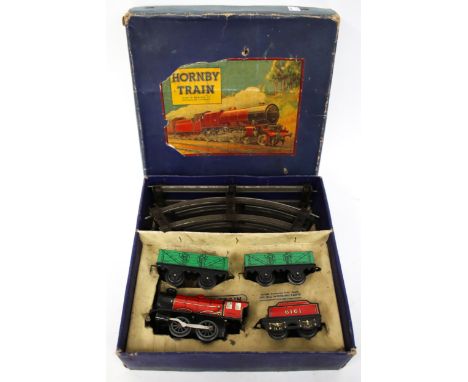 A vintage Meccano Hornby O gauge clockwork train set, boxed. 'M O Goods Set', with loco, tender, two wagons and track. 