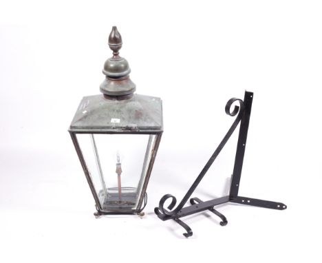A copper-topped Victorian street lamp, now with a flat wall mounting bracket. Bears the label for 'Foster & Pullen, anvil wor