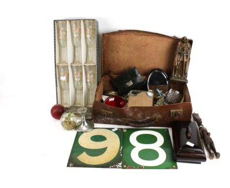 A group of assorted collectables in an old suitcase. Including glass ornaments, Wilkinson Sword safety razor and two enamel n