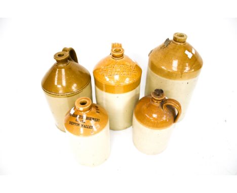 Five vintage stoneware flagons. Marked with various labels including 'The Charlton Brewery Co. Ltd. Shepton Mallet', Max. H47
