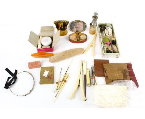 An assortment of vintage collectables. Including compacts, a pair of glove stretchers, hat pins, etc.