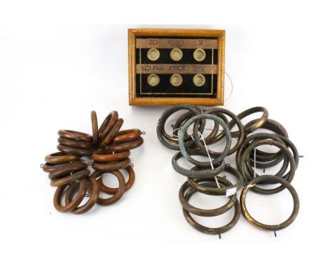 A vintage butler's room indicator and two sets of curtain rings. The indicator contained within a mahogany frame, L27cm, one 