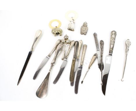 A collection of English silver flatware. To include a fiddle pattern table spoon; a crested fiddle and thread pattern dessert