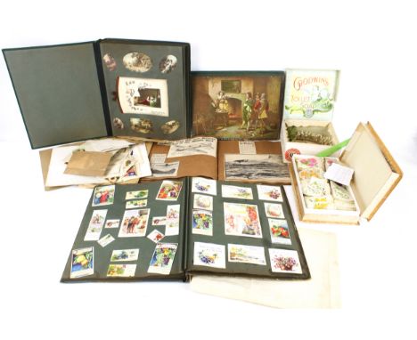 An assortment of vintage works of creativity. Including scrap books (some with military cuttings), silks, cards, paper lace, 