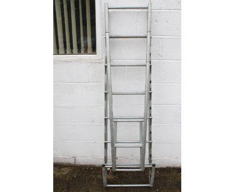 A multiple folding metal ladder. H182cm (folded)