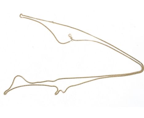 A vintage unmarked yellow metal curb link long guard chain and dog clip. 56cm long. 29.1g gross