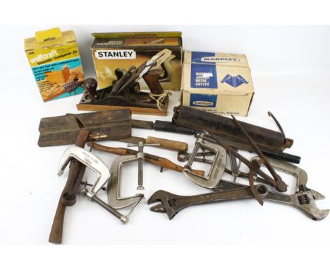 A collection of assorted vintage hand tools. Including chisels, pliers and a plane, etc. 