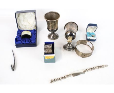 A small quantity of silver items including jewellery. Comprising; a pair of small trophy cups, Birmingham 1936, 79g; a foliat