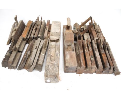 An assortment of vintage carpenters' wood working tools. Including moulding planes and jack planes