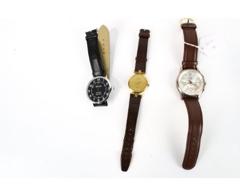 Three modern round wrist watches. Comprising: Ted Lapidus, Paris, a lady's gold-plated and stainless steel round wristwatch, 