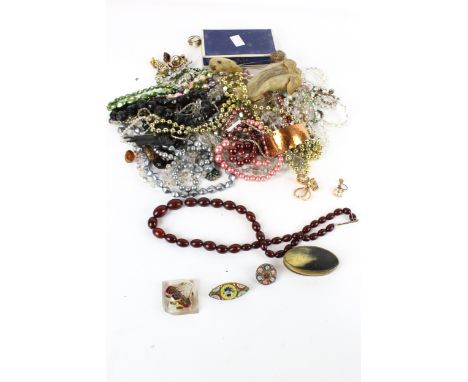 A collection of mostly costume jewellery. To include an imitation-amber graduated oval bead necklace; a lucite lozenge-shaped