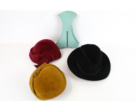 Three vintage hats plus two wooden hat stands. Including a gentleman's Borsalino, Italy black felt trilby size 3.5, etc. 