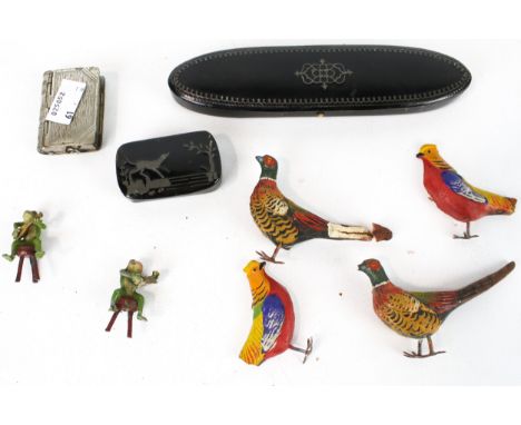 A group of assorted small vintage collectables. Including a vesta match case, a black lacquer snuff box and model birds, etc.