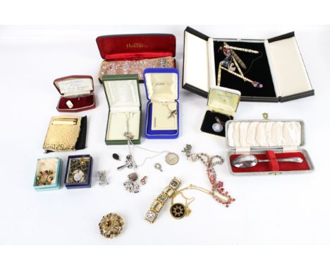 A small collection of silver and costume jewellery and other items. Including a round pendant depicting a rearing horse stamp