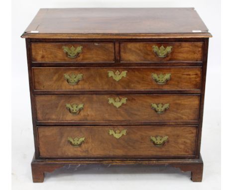 A GEORGIAN MAHOGANY CHEST OF TWO SHORT AND THREE LONG DRAWERS  with brass swan neck handles and raised on bracket feet, 84cm 