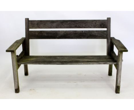 A TEAK GARDEN BENCH  with a slatted back and seat, 136cm wide 