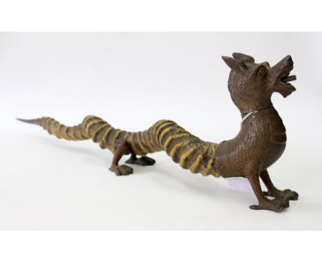AN ANTIQUE EASTERN BRASS AND ANTLER CHINESE DRAGON CIGAR LIGHTER, 51cm in length