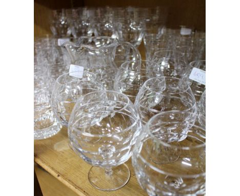A SUITE OF CONTEMPORARY CUT GLASS WARE with eight large wine glasses, 21cm high together with two further sizes of wine glass