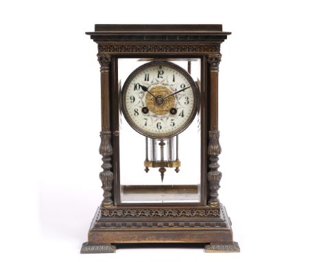 A FRENCH BRASS FOUR GLASS MANTEL CLOCK the cream enamel Arabic dial decorated with floral swags, twin train Mougin movement w