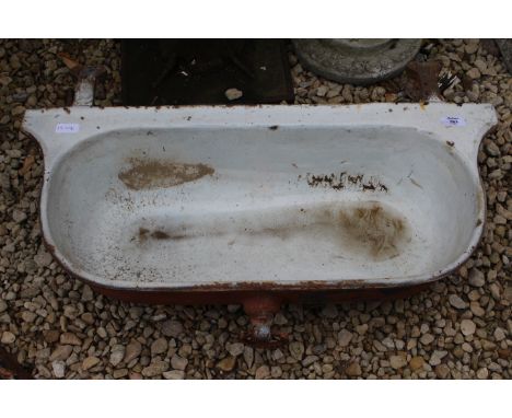 AN OLD ENAMELLED CAST IRON FRENCH WATER TROUGH for wall mounting, 78cm wide