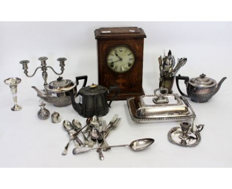 AN AMERICAN OAK CASED MANTLE CLOCK EPNS tureen and cover, coffee and tea pots, a selection of chamber sticks, cutlery, servin
