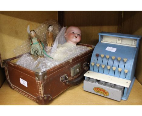 AN ARMAND MARSEILLE BISQUE HEADED DOLL No. 351/3 K, together with two peg dolls, a small suitcase and a Codeg toy cash til 