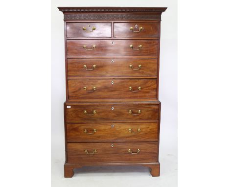 A GEORGE III MAHOGANY CHEST ON CHEST with blind fret carved decoration, two short and six long drawers, all with brass handle