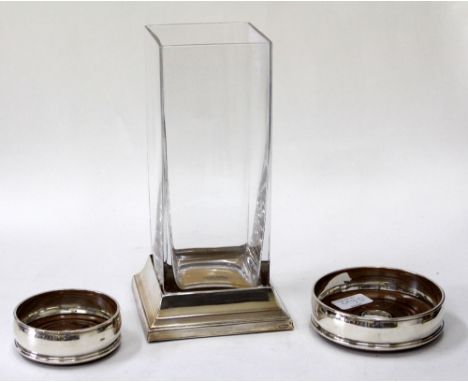 A SILVER SQUARE SECTION WINE BOTTLE COASTER together with two circular wine bottle coasters (3)