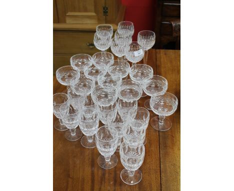 A GROUP OF WATERFORD HOBNAIL CUT WINE GLASSES consisting of six Hock glasses, twelve champagne cups and twelve white wine gla