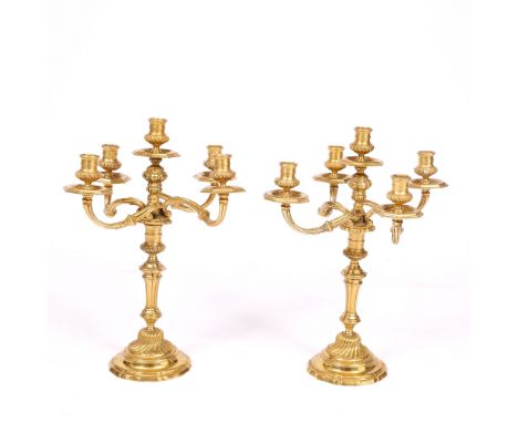 A PAIR OF LOUIS XVI STYLE FOUR BRANCH FIVE LIGHT GILT CANDELABRA 41cm high 