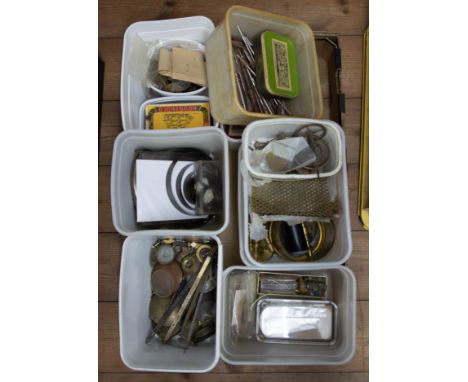 A quantity of various watchmakers parts, brass turnings, cogs, tools, springs, pendulums etc.